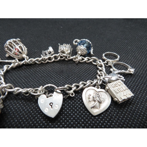 27 - Vintage silver charm bracelet with 10 charm Birmingham 1963 45g