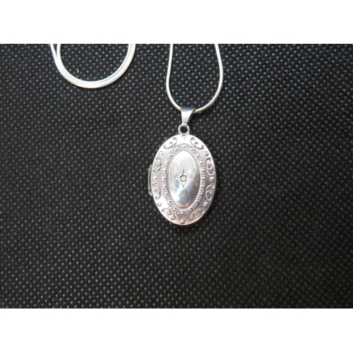 44 - Diamond set silver locket on 18