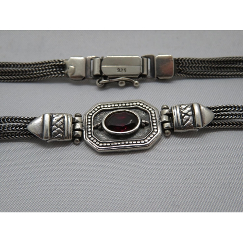 73 - Silver bracelet set with oval garnet stone 7.5