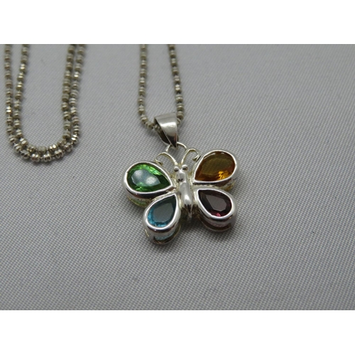 83 - Pretty silver multi gem set butterfly on 18