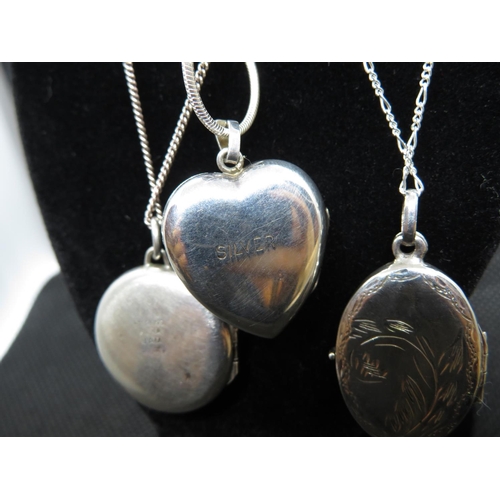 57 - 3x silver lockets and chains