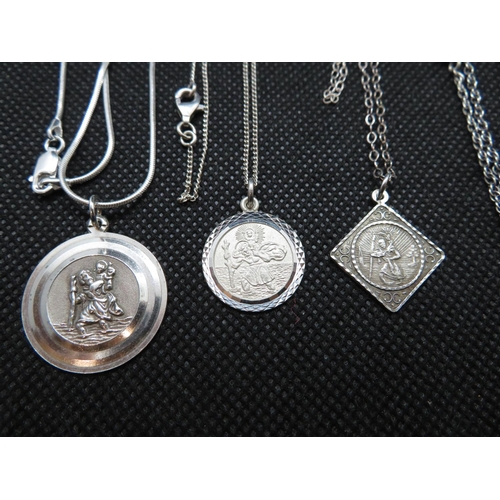 63 - 4x St. Christopher medallions on 18