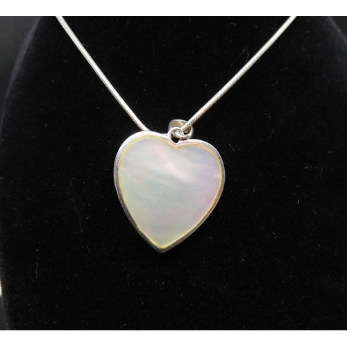 64 - Pretty pierced silver reversible Mother of Pearl heart shaped pendant on 18