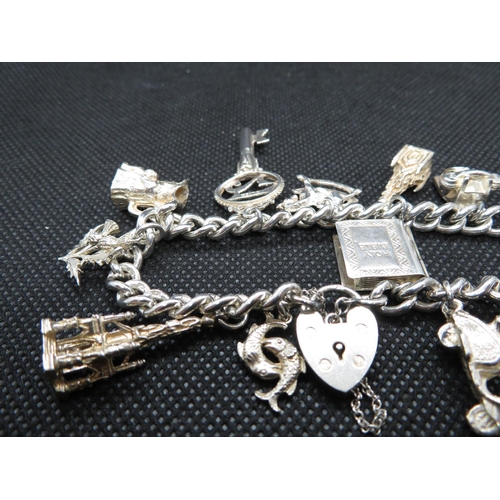 67 - Vintage silver charm bracelet with 12x charms every link HM Lion Passant and full HM padlock Birming... 