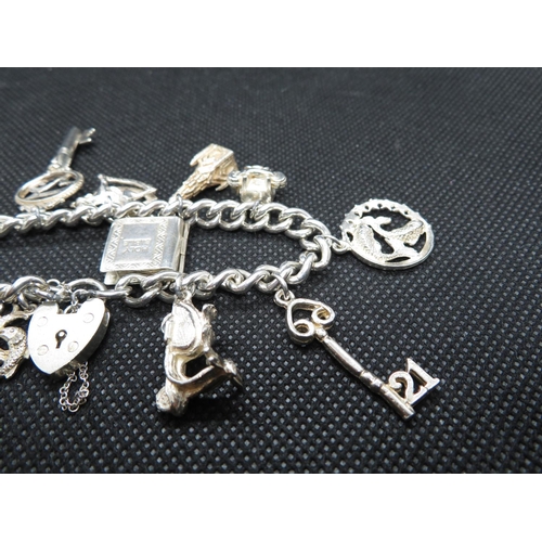 67 - Vintage silver charm bracelet with 12x charms every link HM Lion Passant and full HM padlock Birming... 