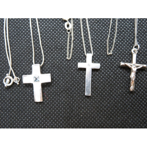 73 - Silver diamond set cross and chain Mother of Pearl and blue topaz cross and chain and silver crucifi... 