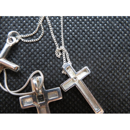 73 - Silver diamond set cross and chain Mother of Pearl and blue topaz cross and chain and silver crucifi... 