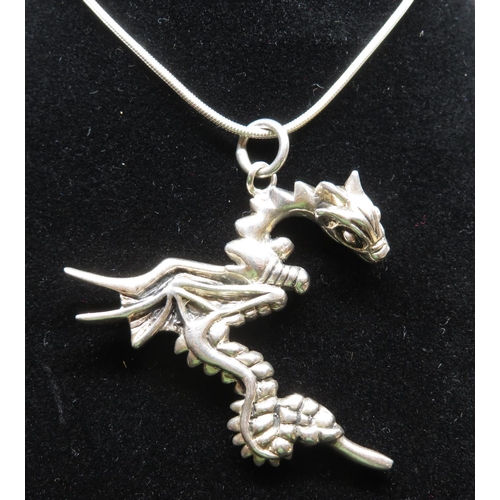 79 - Silver dragon pendant on 18