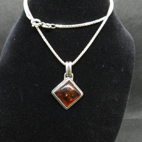 40 - Silver pendant set with baltic amber on 16