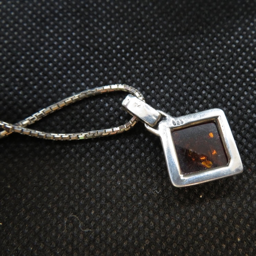 40 - Silver pendant set with baltic amber on 16