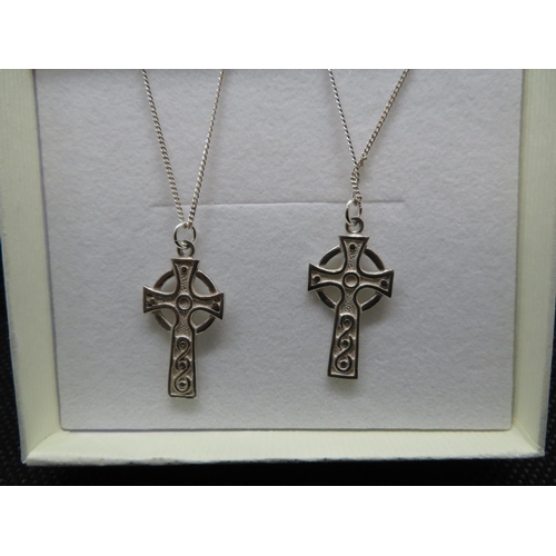 52 - Matching pair of Iona silver crosses on 16