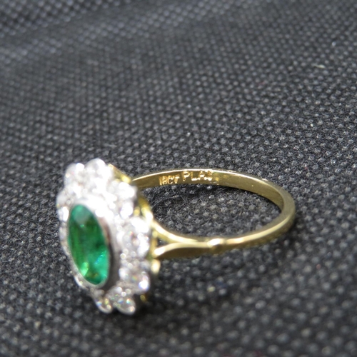 7 - 18ct gold and platinum cluster ring with central oval emerald approx 1.2ct with 10 natural brilliant... 