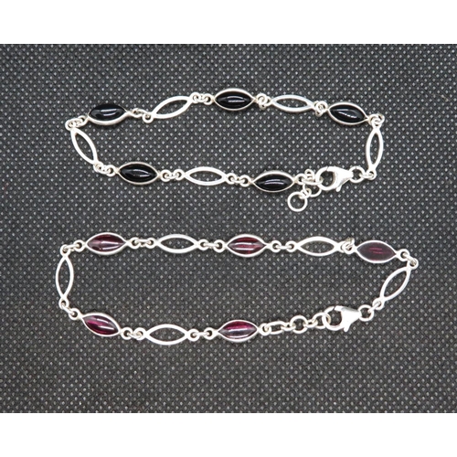 24 - Pair of silver bracelets set with almondine garnets and black onyx 7.5