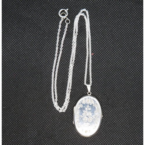 33 - Silver floral engraved locket on 20