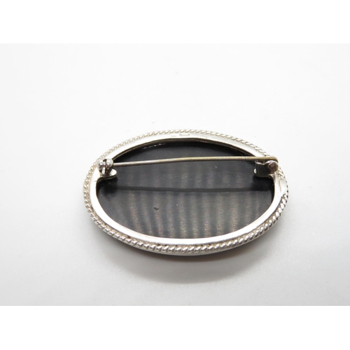 31 - Silver brooch set with large oval black onyx stone Sheffield 1994 13.9g