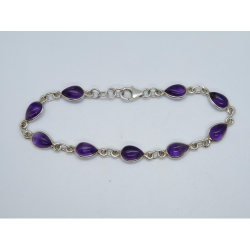33 - Silver bracelet set with pear shaped cabochon amethyst 7.75