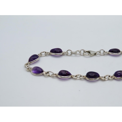 33 - Silver bracelet set with pear shaped cabochon amethyst 7.75