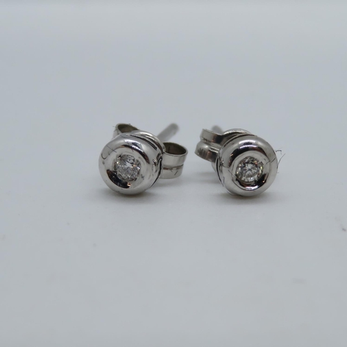 57 - Pair of 9ct white gold and diamond earrings