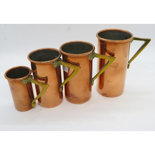 398 - Graduated set of copper measuring cups from .25 - full