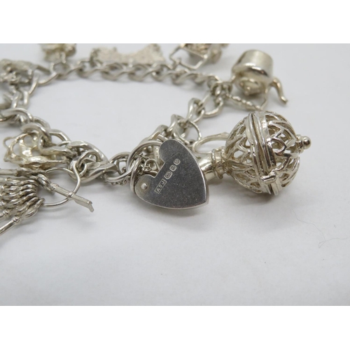 89 - Vintage silver charm bracelet with 10 nice charms London 1978  35.9g