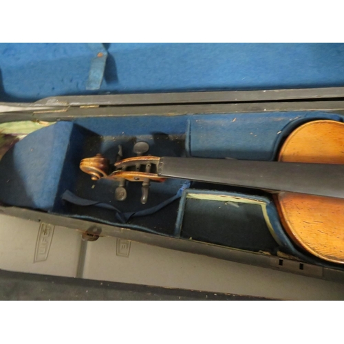 283 - 3/4 violin in wooden sarcophagus case
33cm by 19cm