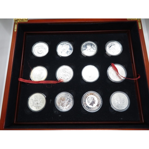 393 - 12x 1oz pure silver Coins of The World in Executive Collectors Wooden Box