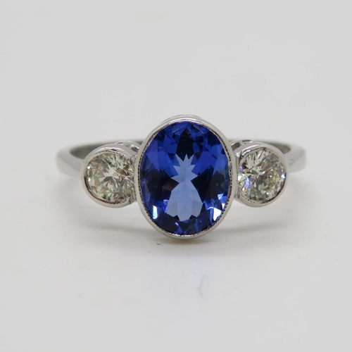 94 - Platinum 3x stone ring with centre Tanzanite 1.3ct and 2x natural brilliant cut diamonds .42ct size ... 