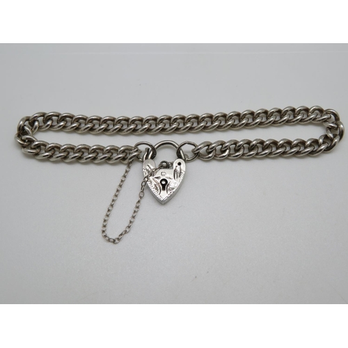 96 - Vintage silver bracelet with engraved lock and chain London 1965 7.25