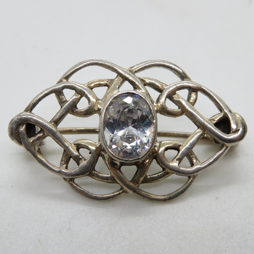 99 - Celtic silver infinity brooch set with oval CZ