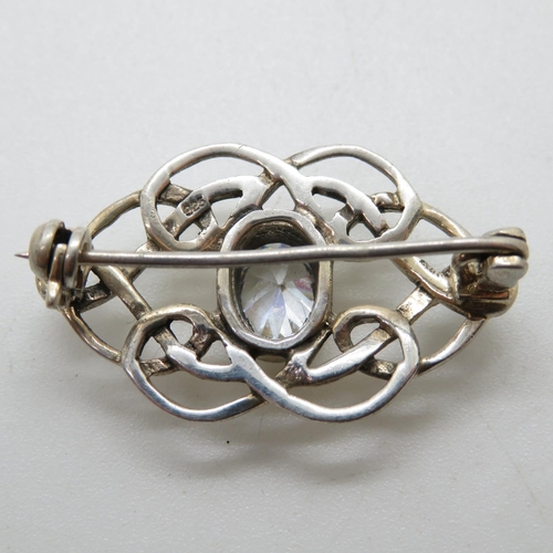 99 - Celtic silver infinity brooch set with oval CZ