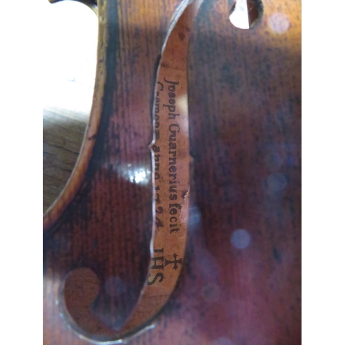 283 - 3/4 violin in wooden sarcophagus case
33cm by 19cm