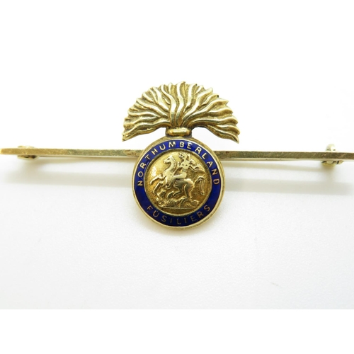 202 - 15ct and enamel boxed Northumberland Fusiliers brooch 5.27g