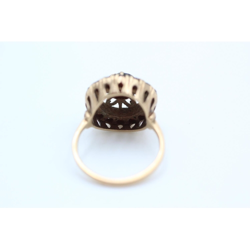 106 - 9ct gold ornate garnet target ring size M