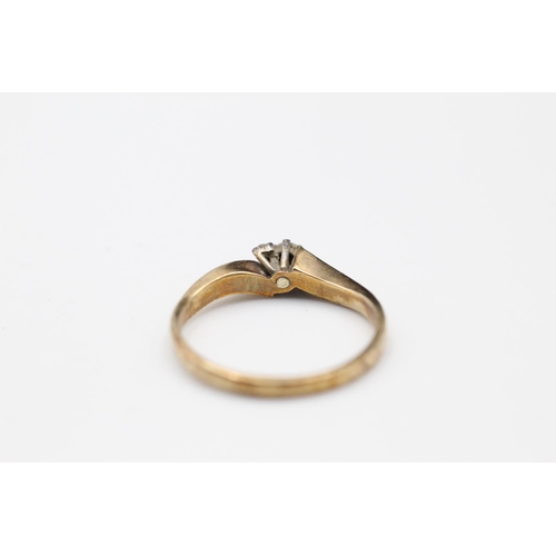 113 - 9ct Gold diamond bypass ring size N