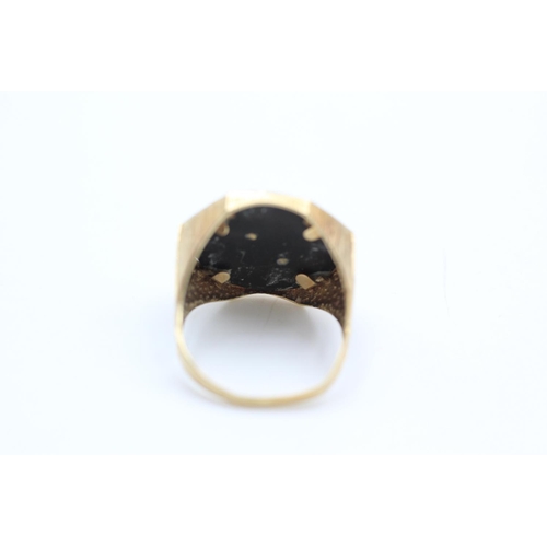 115 - 9ct gold onyx and eagle motif ring size Y