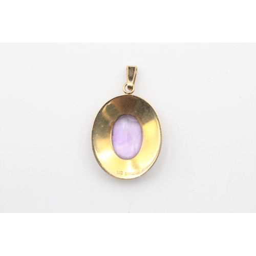 138 - 2 x 9ct Gold gemstone pendants inc. amethyst, sapphire