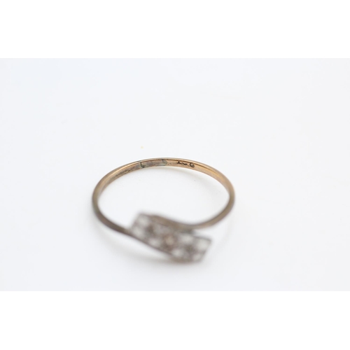 143 - 9ct gold antique diamond twist ring Size R