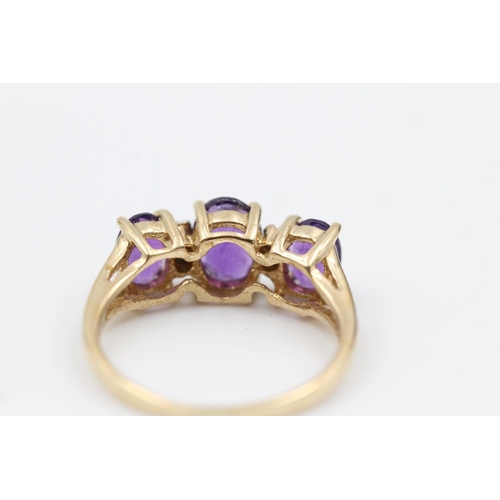 145 - 9ct gold amethyst trilogy ring w/ diamond detail size L