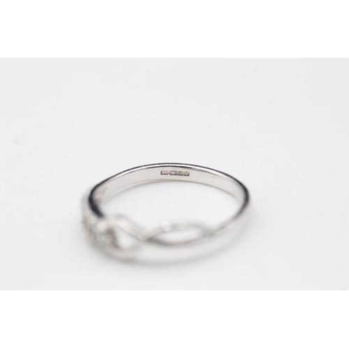 149 - 9ct white gold diamond twist ring size N