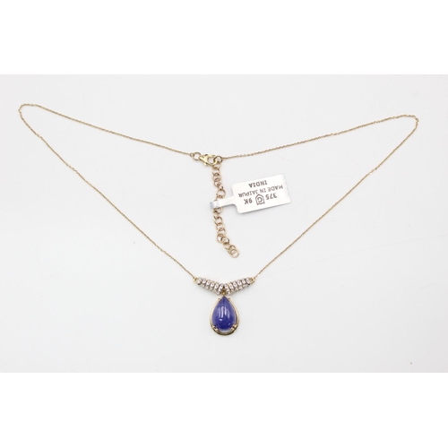 160 - 9ct gold tanzanite and diamond detail necklace