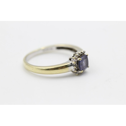 230 - 18ct gold tanzanite & diamond halo ring size N