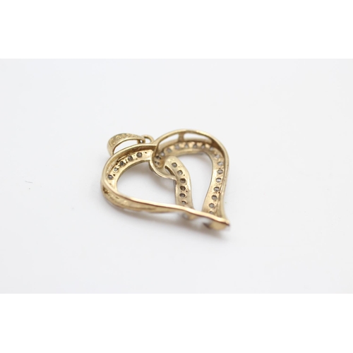 233 - 9ct gold diamond heart pendant