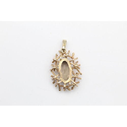 234 - 9ct Gold brutalist design pendant with smoky quartz