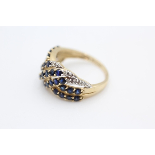 253 - 9ct gold sapphire and diamond cross over ring size N