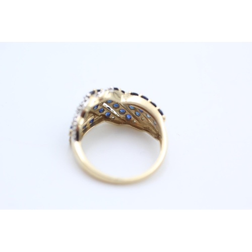 253 - 9ct gold sapphire and diamond cross over ring size N