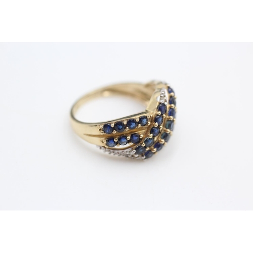 253 - 9ct gold sapphire and diamond cross over ring size N