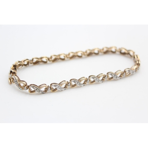 257 - 9ct gold diamond figure of eight bracelet