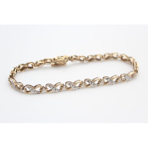 257 - 9ct gold diamond figure of eight bracelet