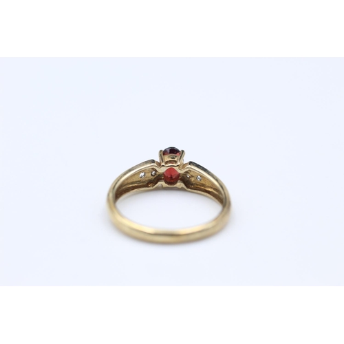 261 - 9ct Gold diamond & garnet detail ring size O