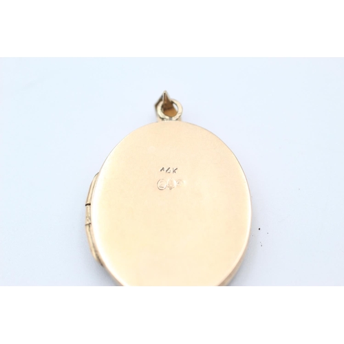 267 - 14ct Gold locket w/ menorah motif